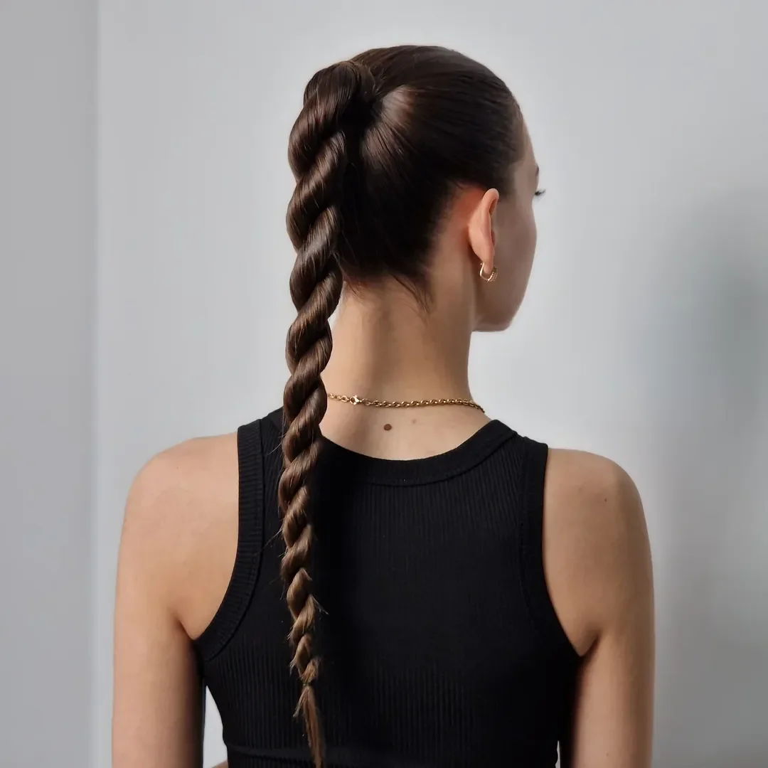 sleek summer ponytail hairstyle 2026 Twisted Statement Ponytail for Evenings