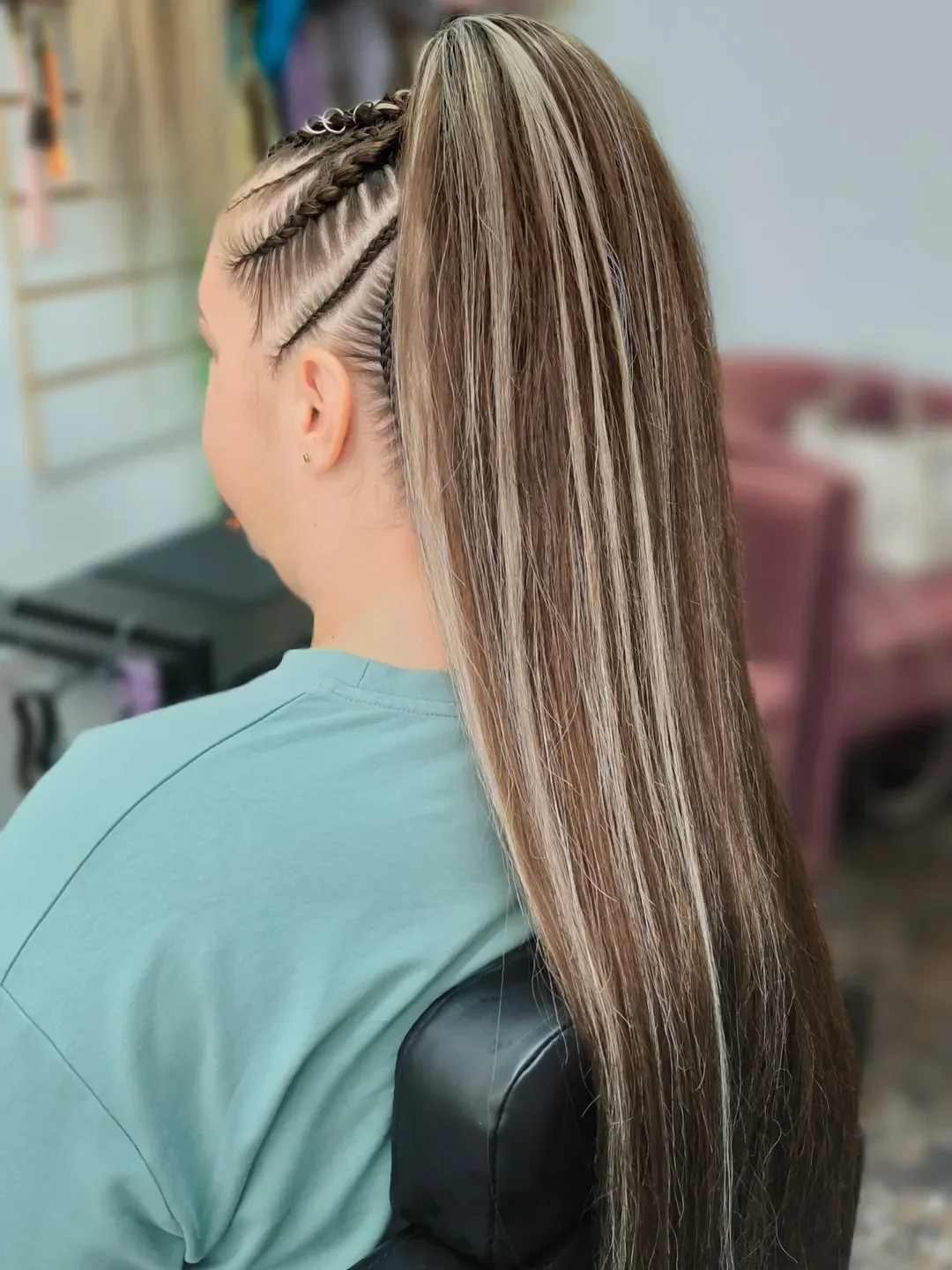 sleek summer ponytail hairstyle 2026 High ponytail with braided sides detail