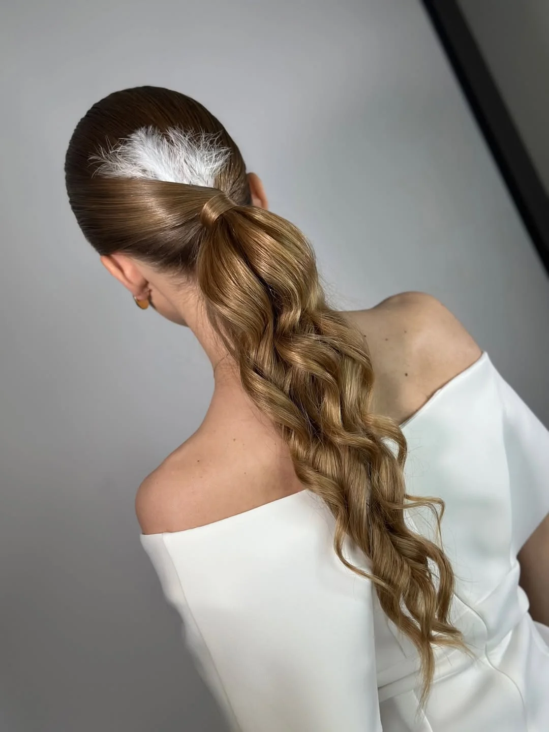 sleek summer ponytail hairstyle 2026 Low sleek ponytail with textured waves