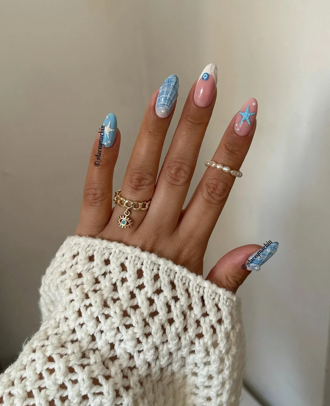 summer beach nails 2026 Blue Coastal Almond Nails With Starfish Accents