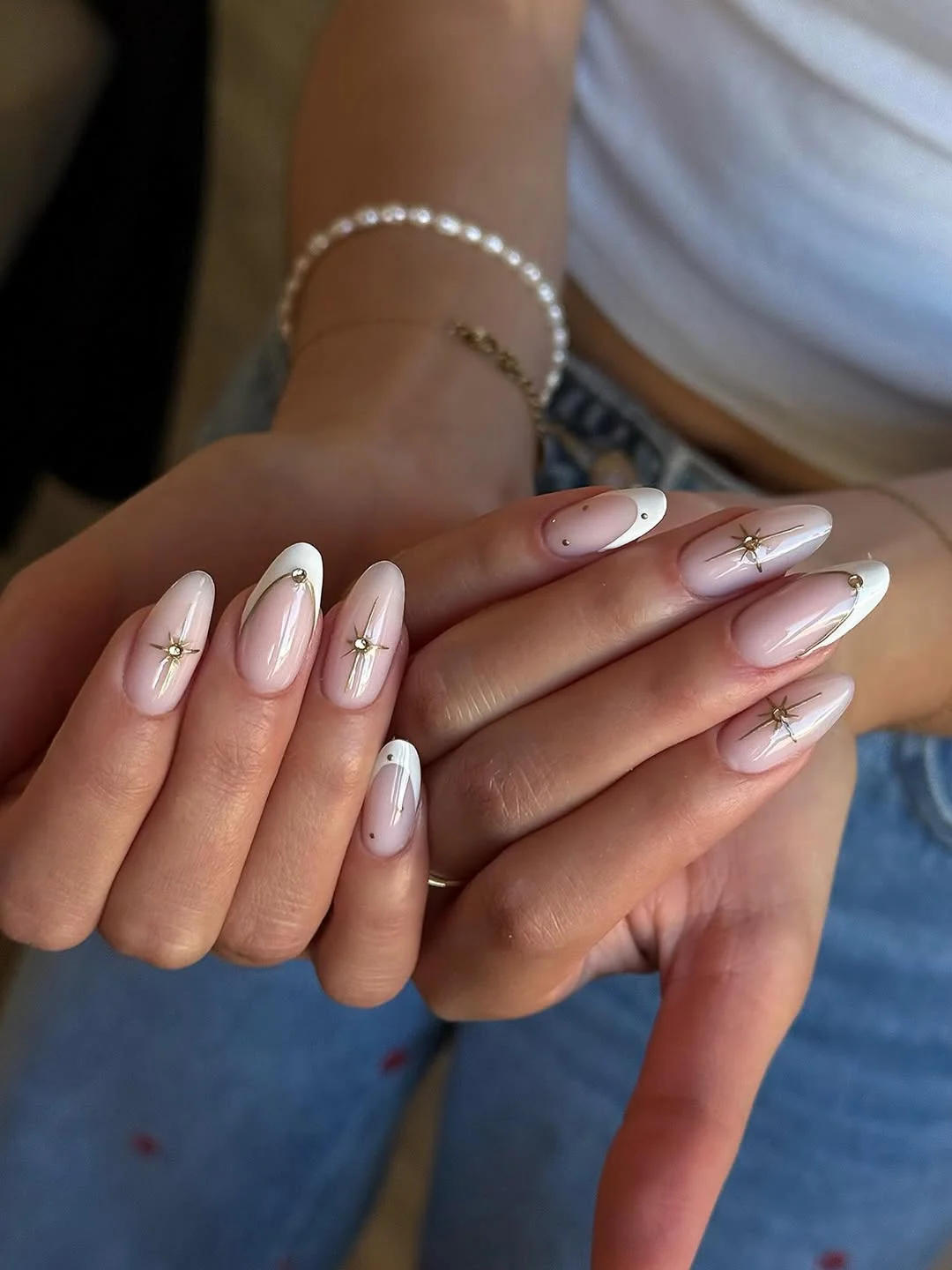 summer french nails ideas 2026 Milky White Almond French Nails With Tiny Starburst Accents