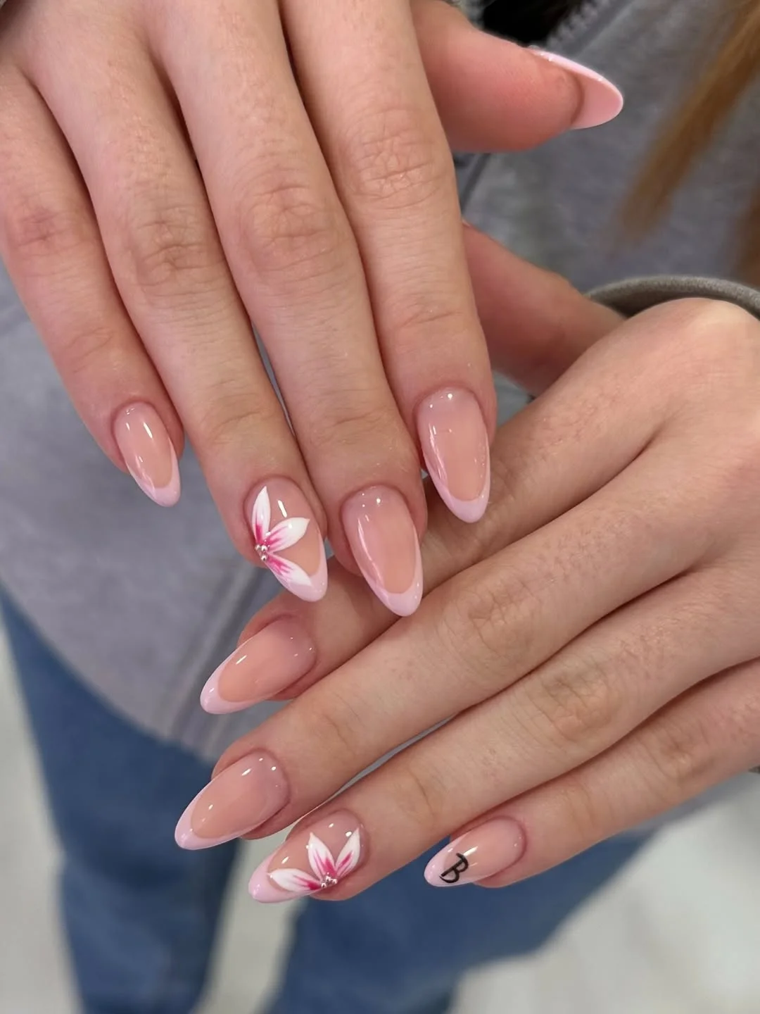 summer french nails ideas 2026 Soft Almond French Nails With Pink Floral Art