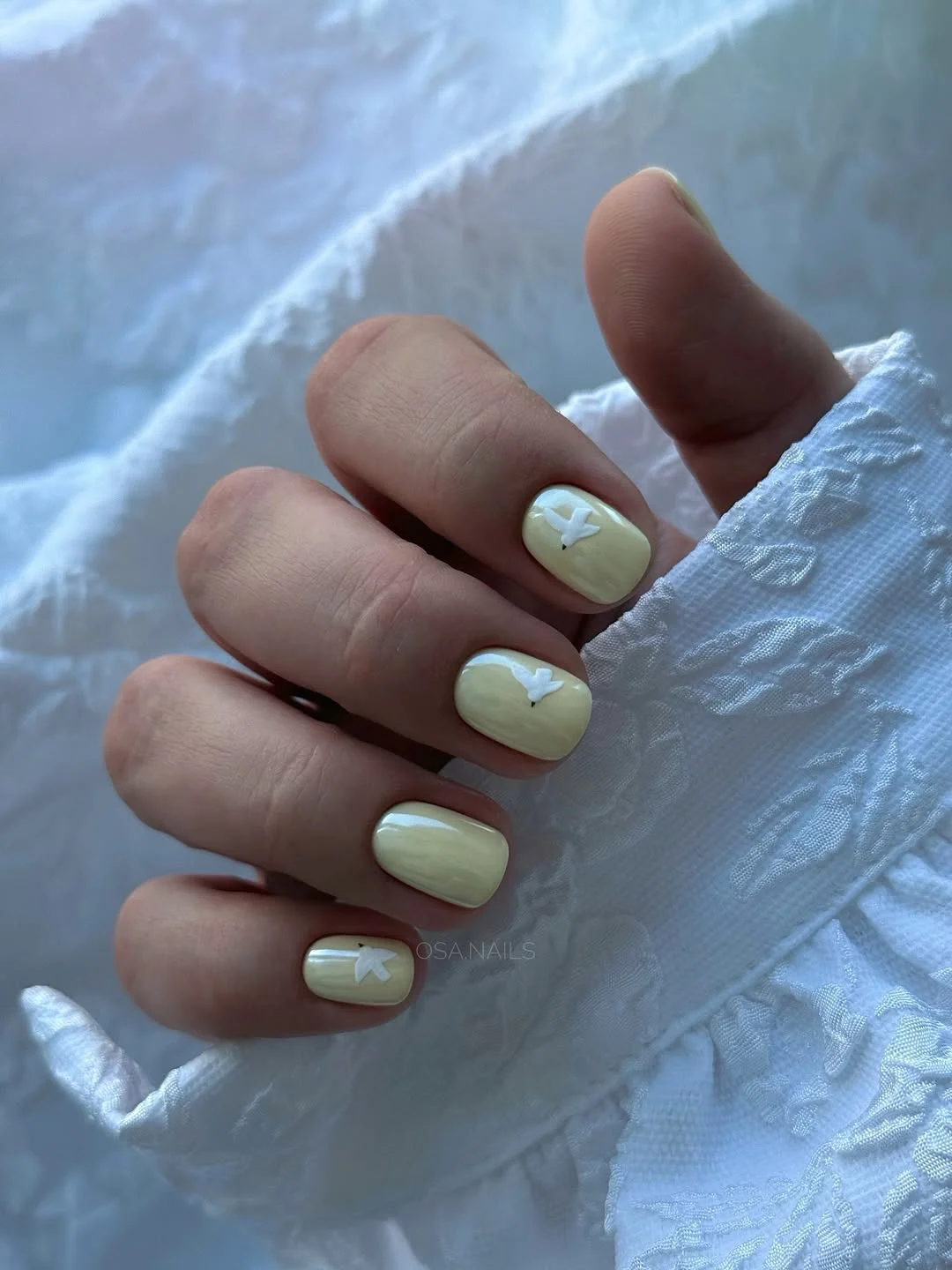 summer gel nails 2026 Soft Vanilla Nails With Tiny White Butterflies