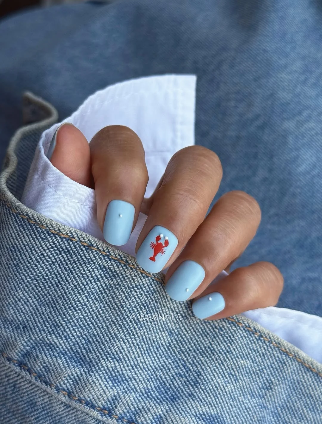 summer gel nails 2026 Baby Blue Beach Nails With Tiny Crab Art