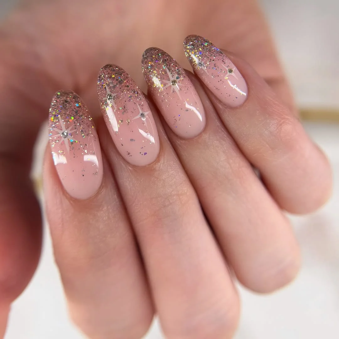 summer glitter nails 2026 Minimal Nude Glitter Nails With Tiny Starbursts