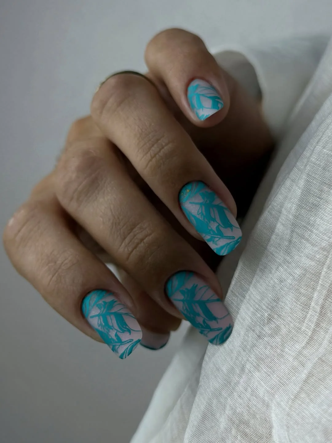 summer manicure color ideas 2026 Blue Tropical Leaf Nail Art