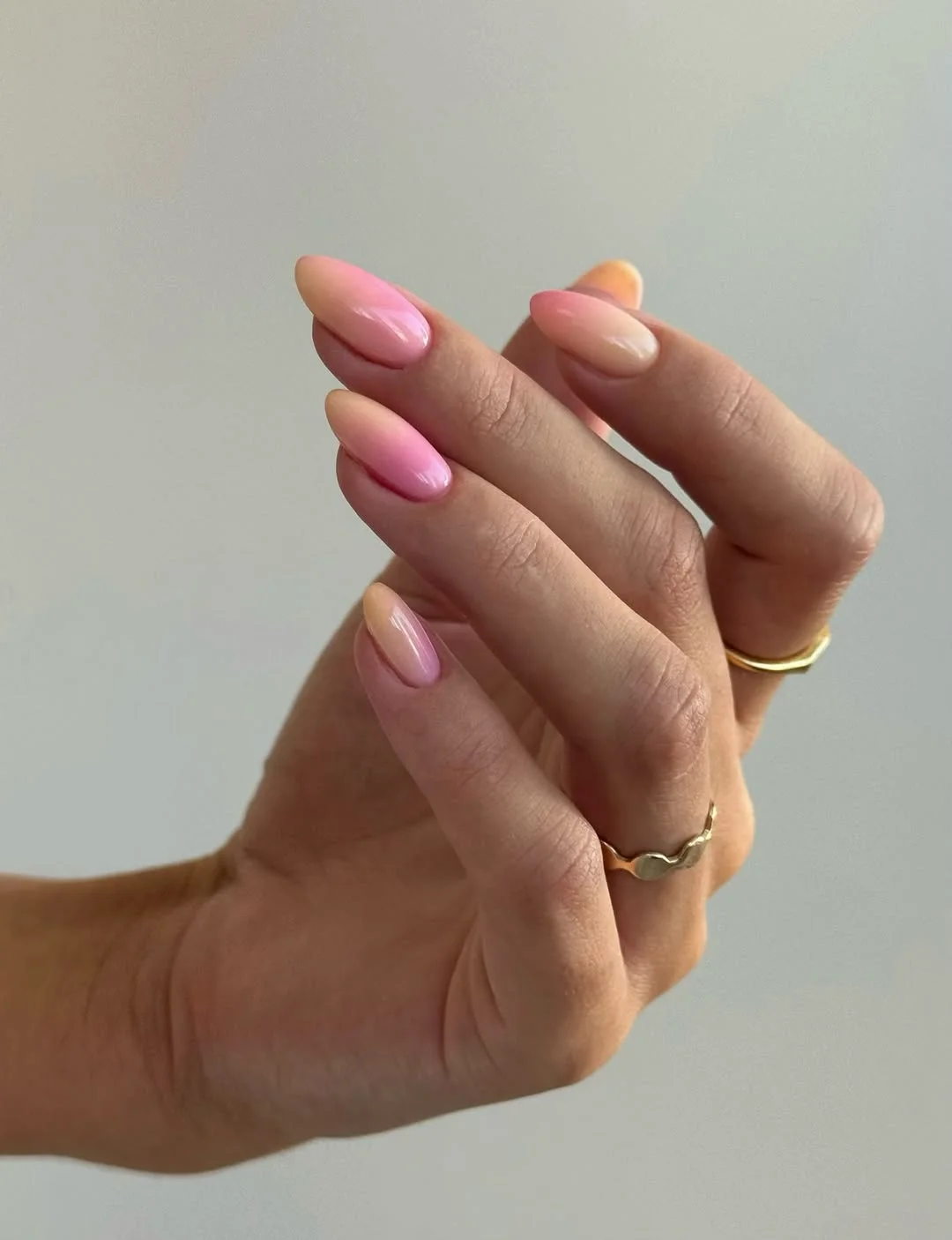 summer manicure color ideas 2026 Glossy Pink Aura Almond Nails