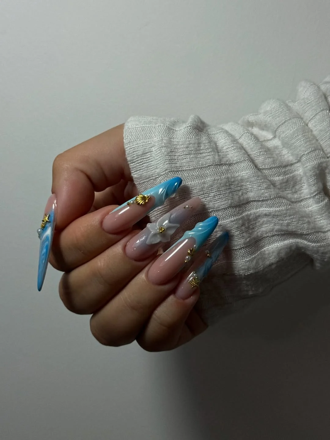 summer stiletto nails 2026 Ocean Inspired Blue Stiletto Nails with Coastal Charm