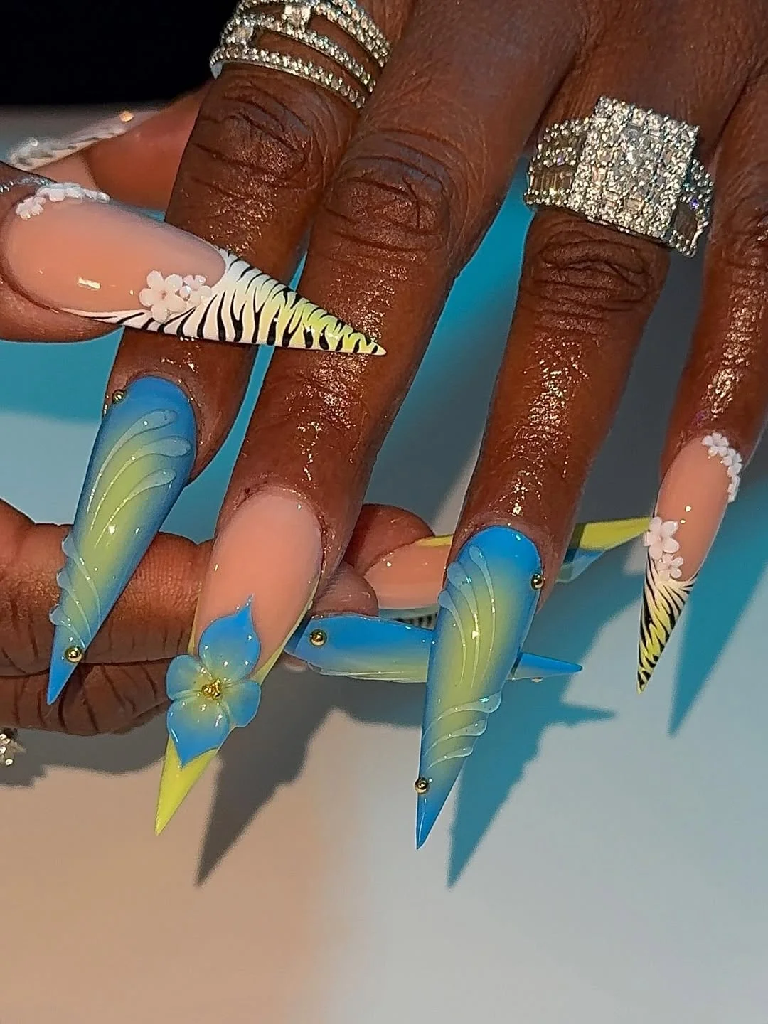 summer vibrant nails summer 2026 Blue Tropical Stiletto Nails With Soft Neon Details