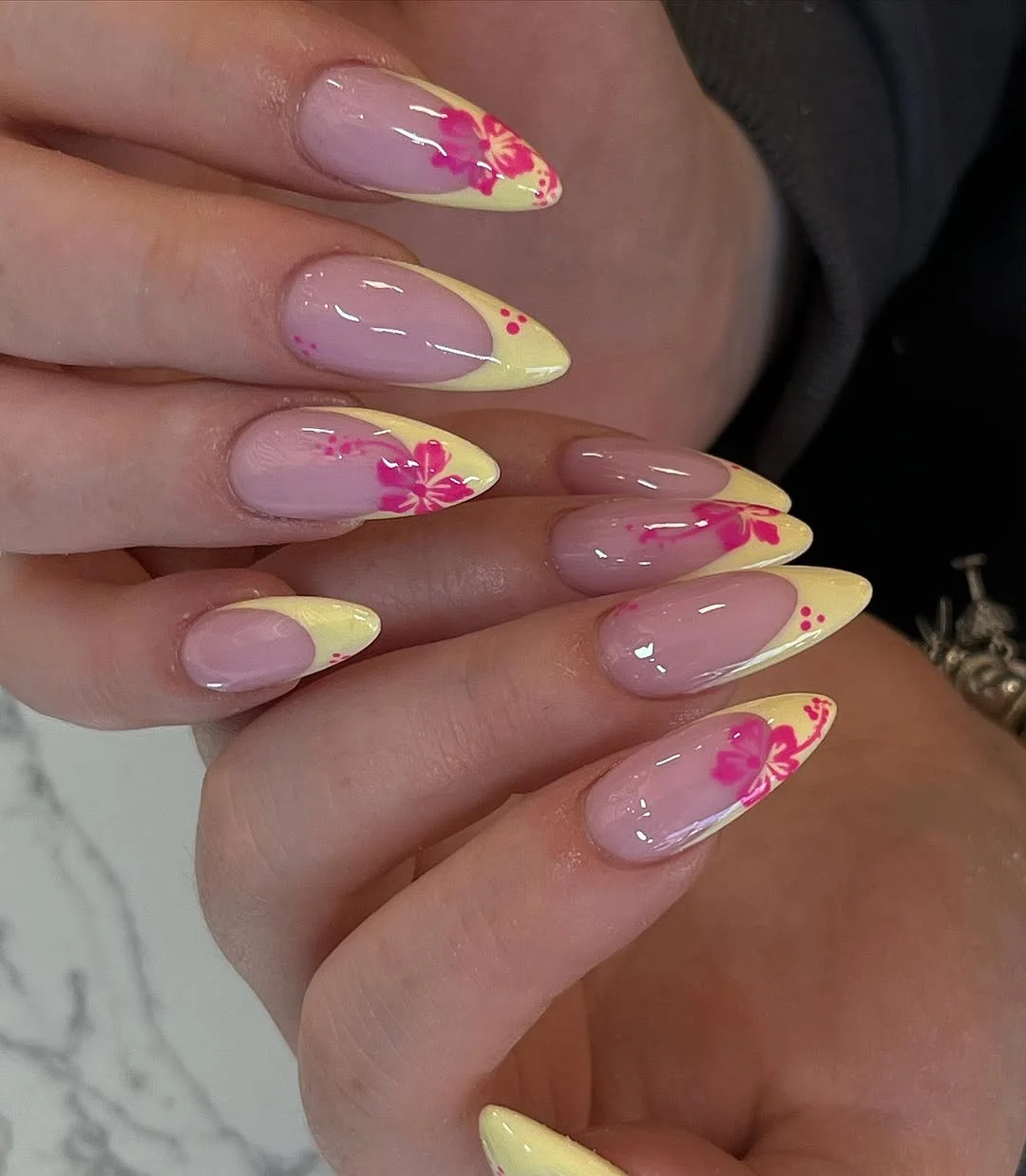 summer yellow nails 2026 Soft Yellow French Tips With Pink Hibiscus Art