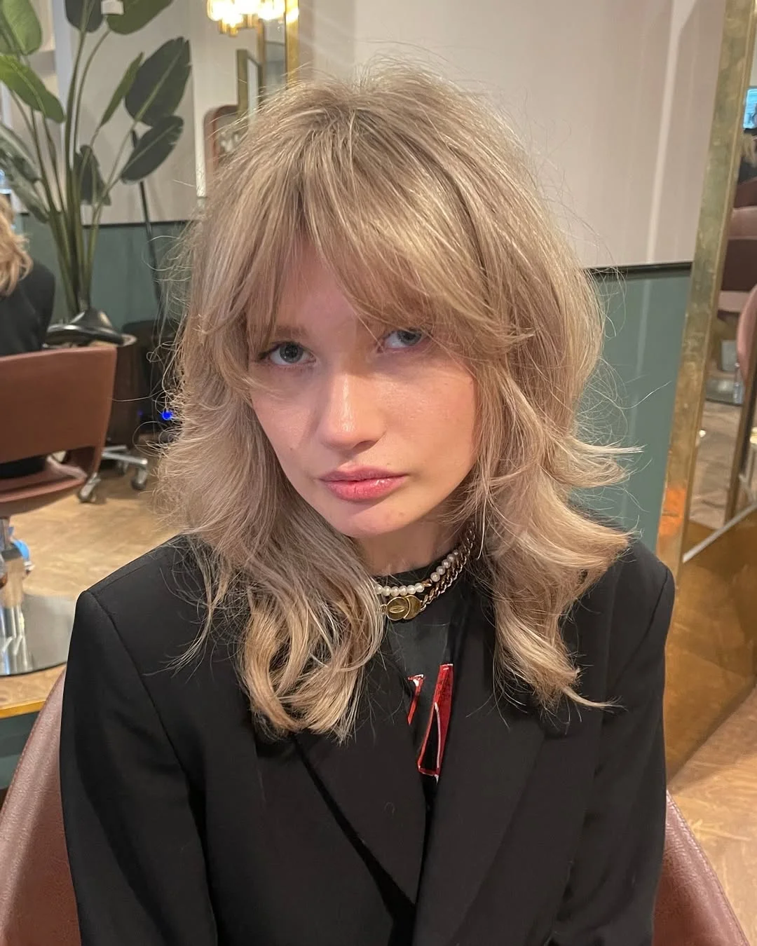 textured summer shag hairstyle 2026 Soft blonde shag with airy bangs and movement