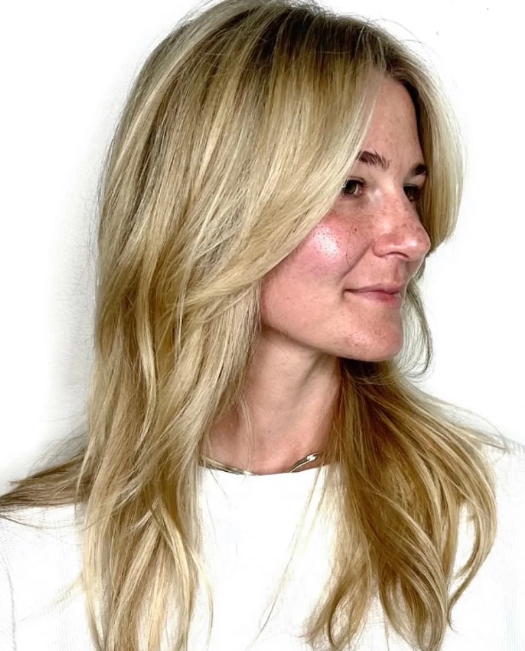 textured summer shag hairstyle 2026 Sunlit layered blonde with natural softness
