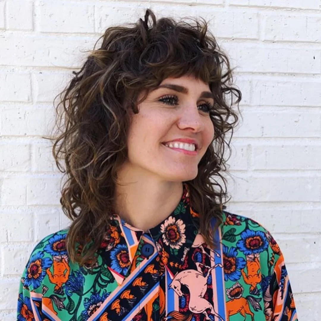 textured summer shag hairstyle 2026 Playful short curly shag with retro energy