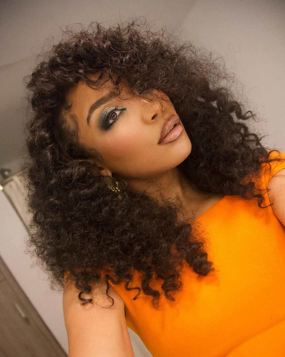 trendy summer hairstyles ideas 2026 Voluminous Curly Layers With Soft Bangs Energy