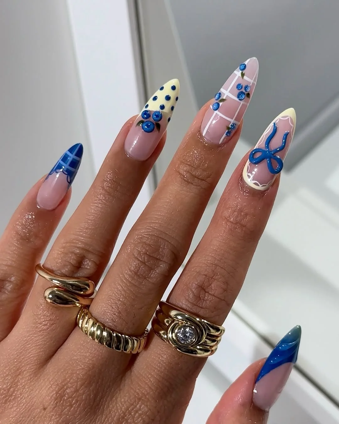 trendy summer nails 2026 Blue Almond Nails With Graphic Details