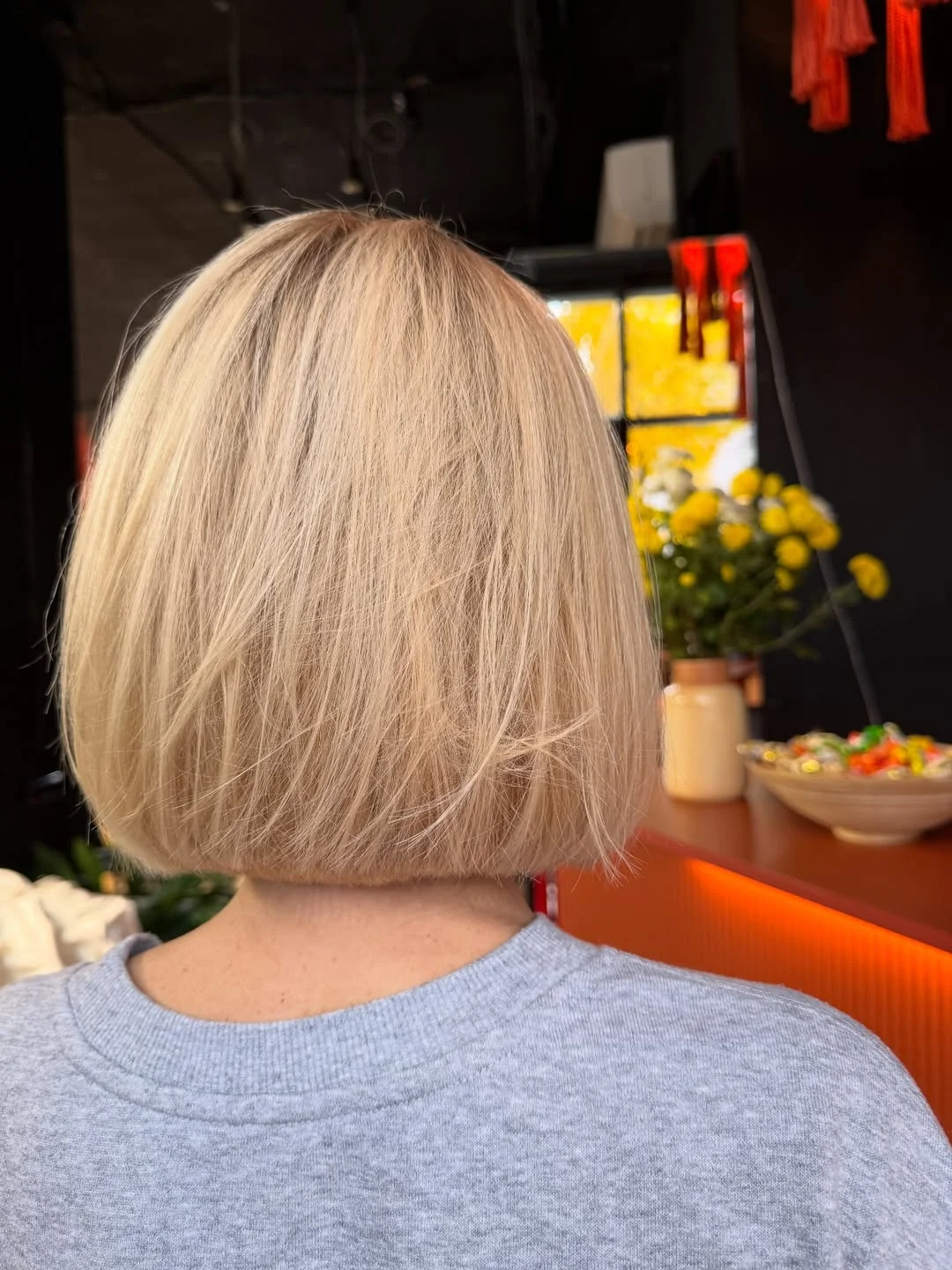 youthful summer haircuts for women over 50 2026 Classic Blonde Bob With a Clean Summer Edge