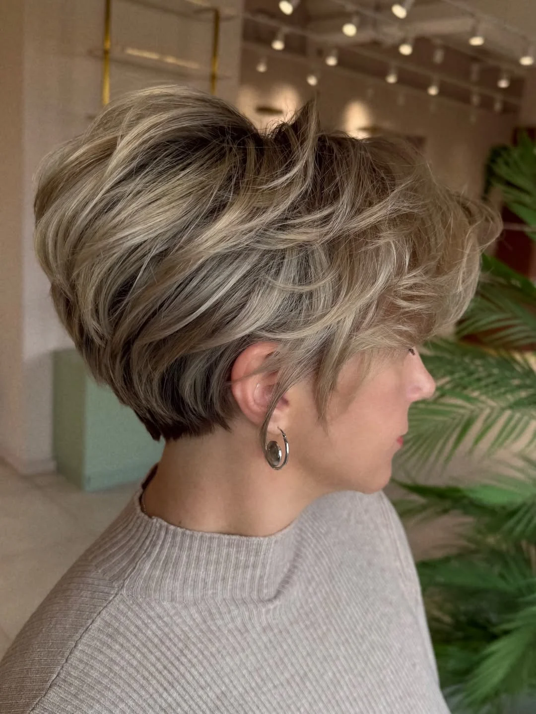youthful summer haircuts for women over 50 2026 Stacked Wedge Bob With Volume at the Crown