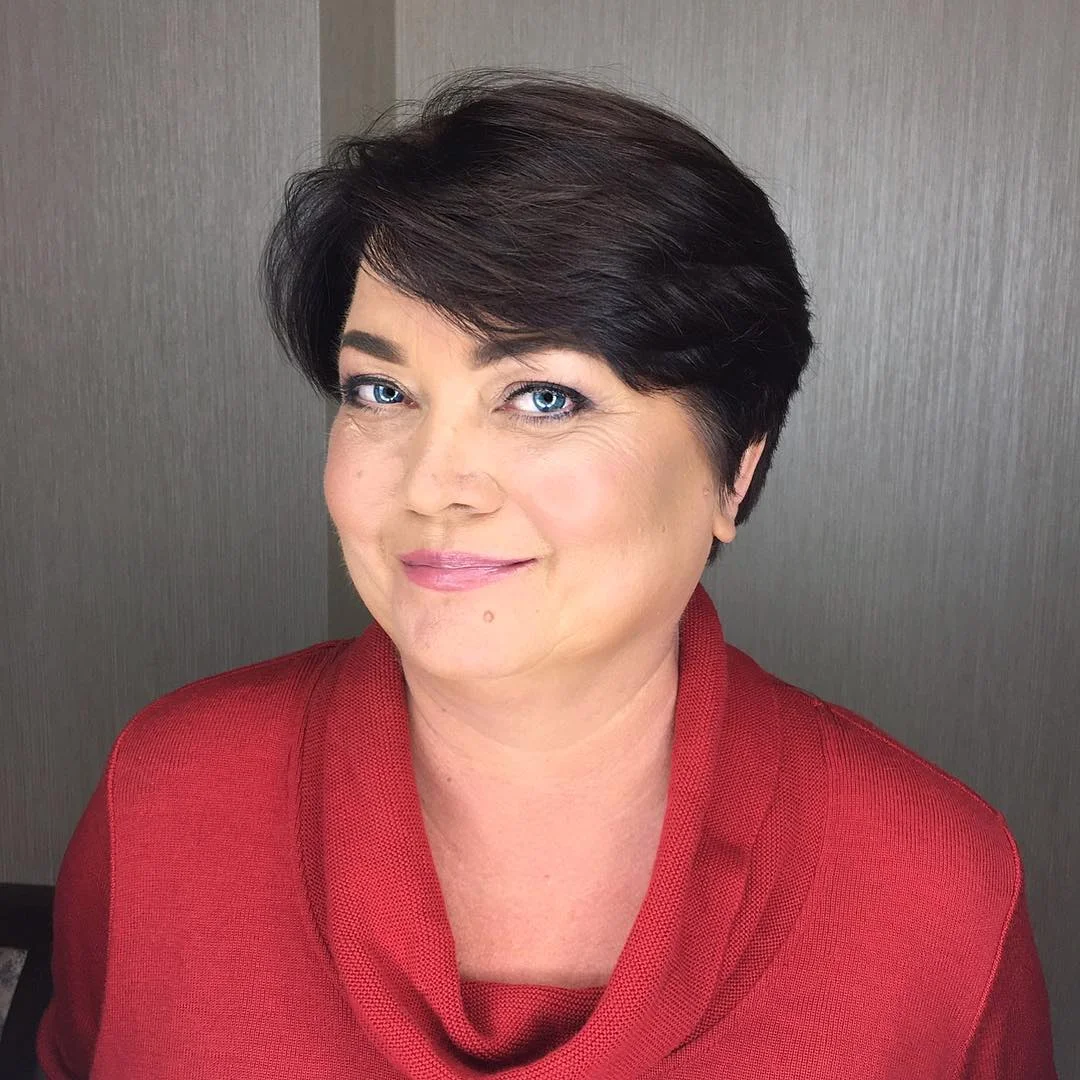 youthful summer haircuts for women over 50 2026 Soft Layered Short Cut With Side Bangs