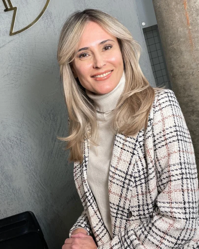 youthful summer haircuts for women over 50 2026 Soft Layered Blonde with Face-Framing Lift