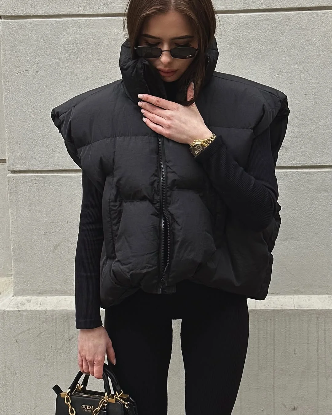 fall outfits with vests 2026 Modern Black Puffer Vest Statement