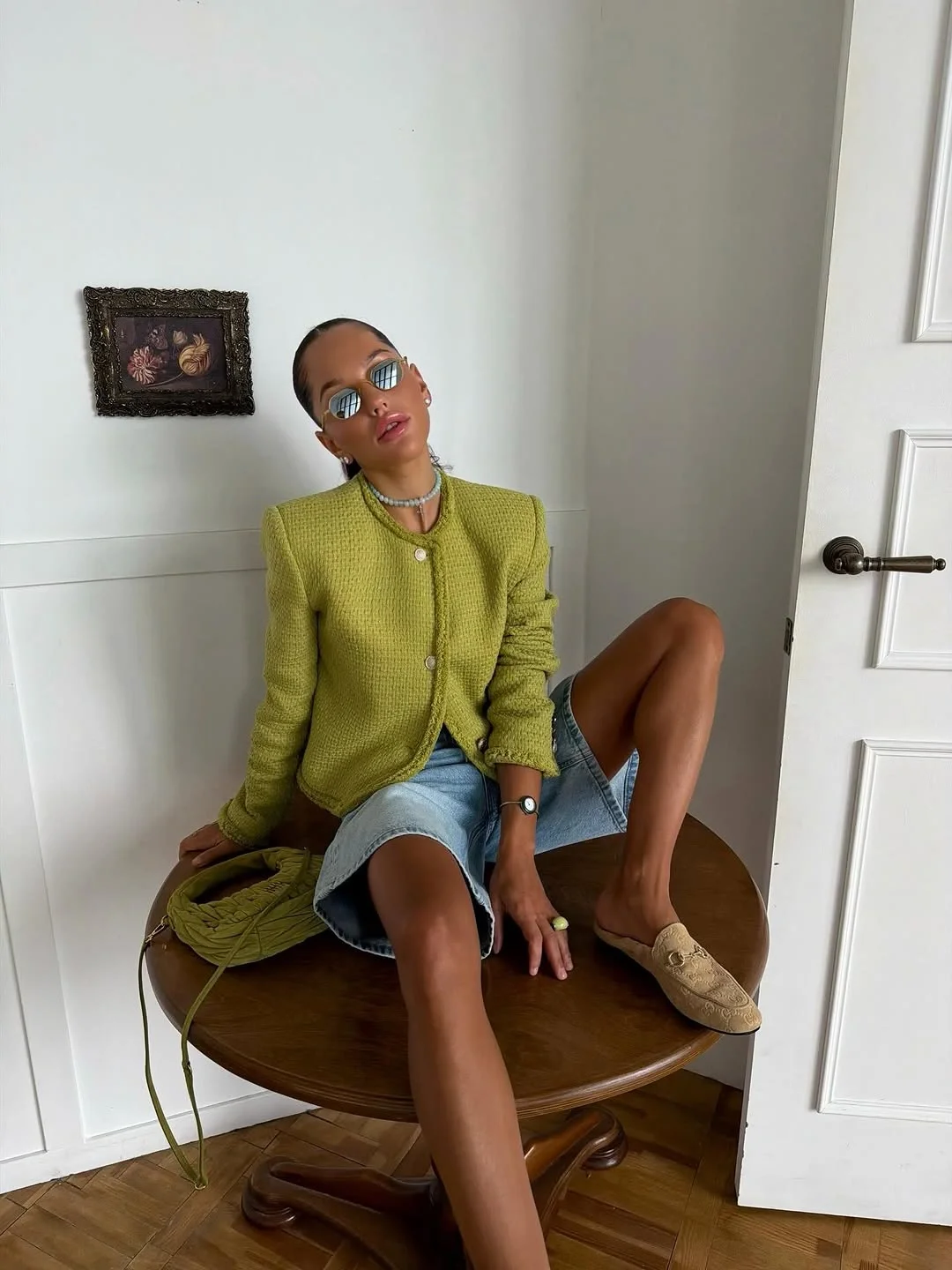 fall travel outfits 2026 Olive Green Jacket And Denim Shorts Combination