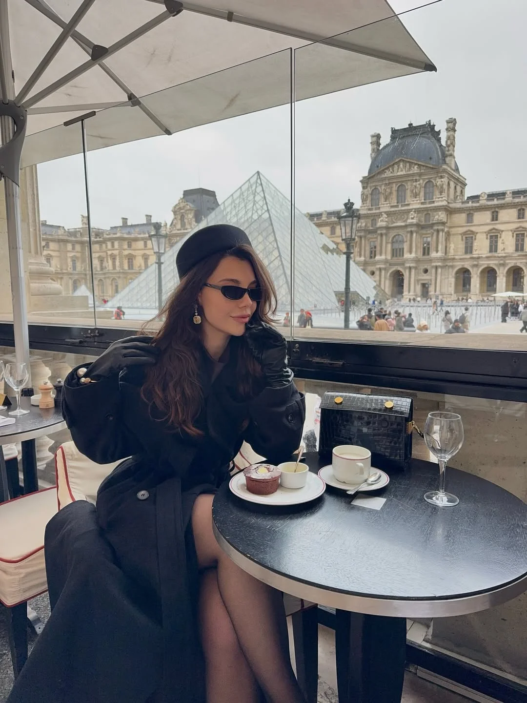fall travel wardrobe for women 2026 Elegant Black Layers for Iconic Destinations