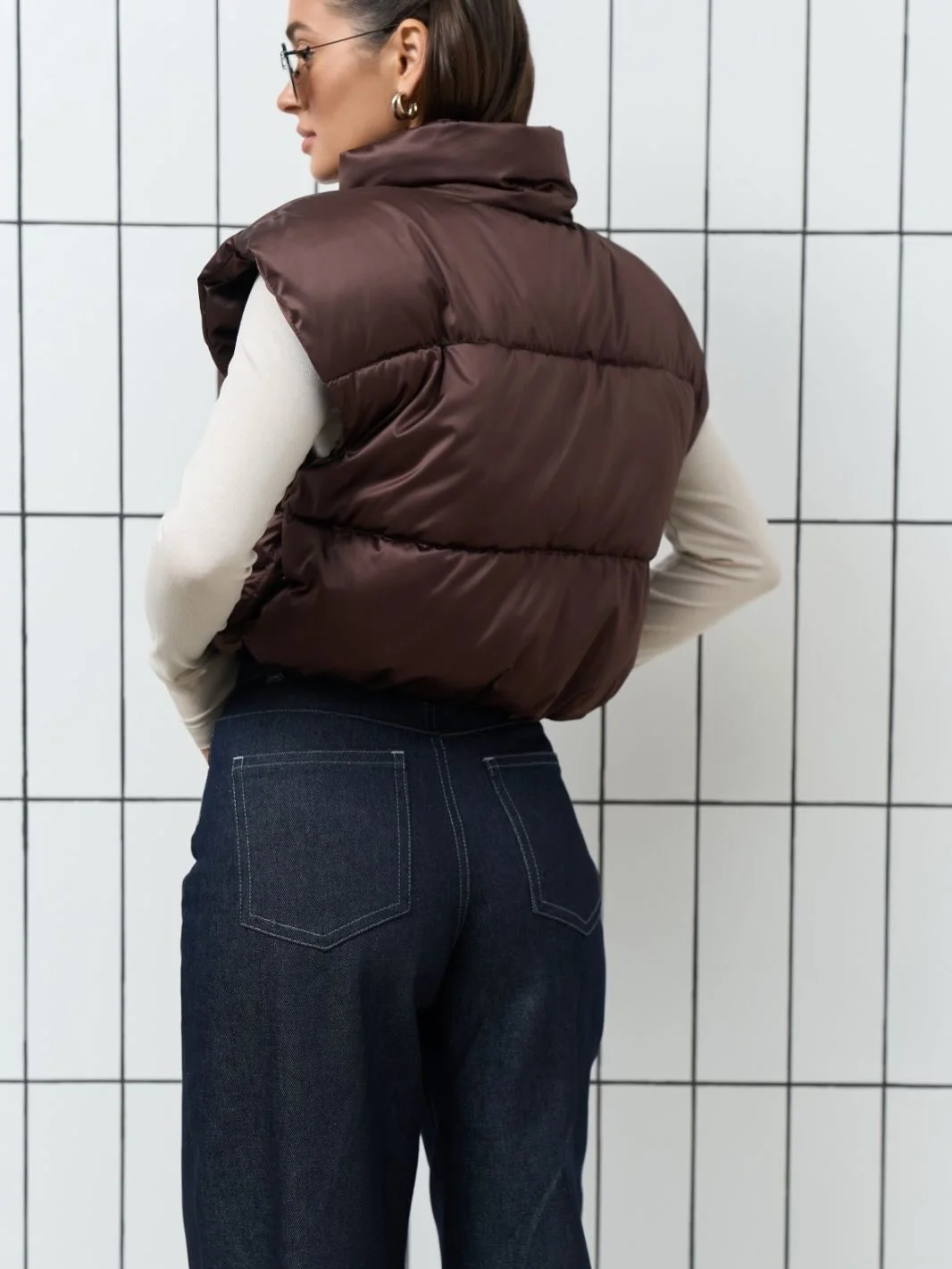fall vest outfits for women 2026 Rich Brown Puffer With Dark Denim