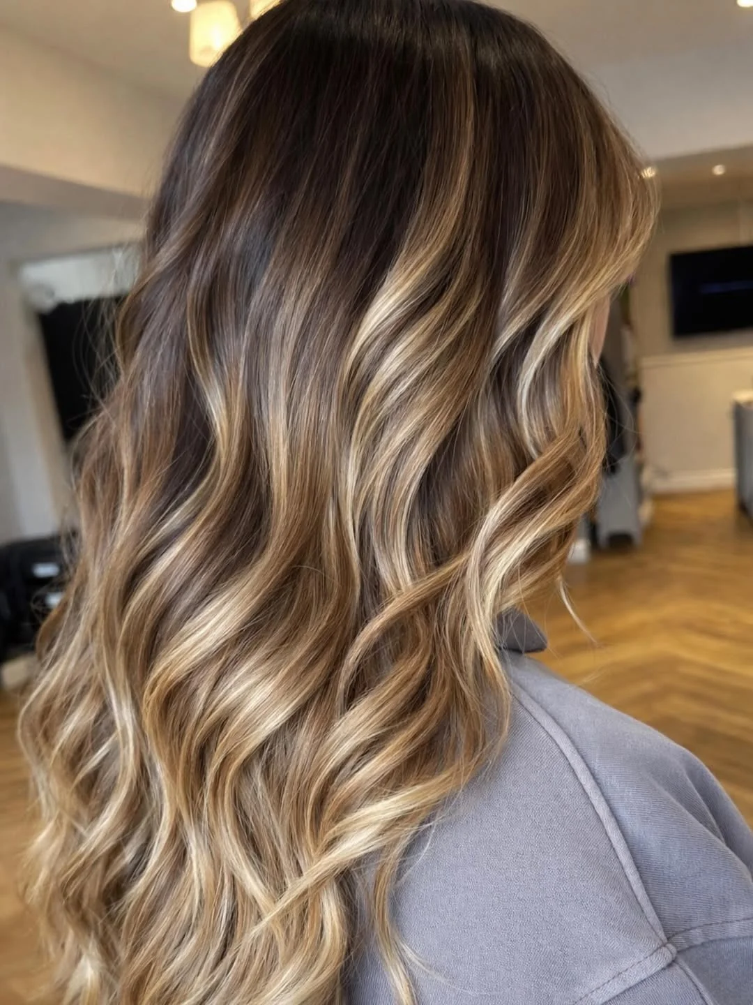 july hair colour ideas 2026 Sunlit Beige Balayage Waves