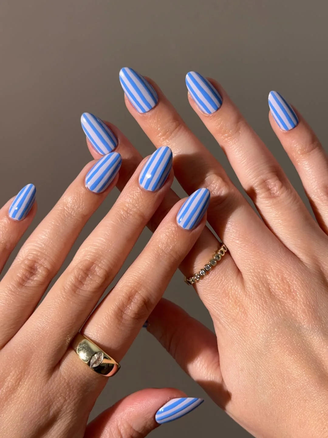 july nail colours ideas 2026 Blue Stripe Nails Inspired by Coastal Summers