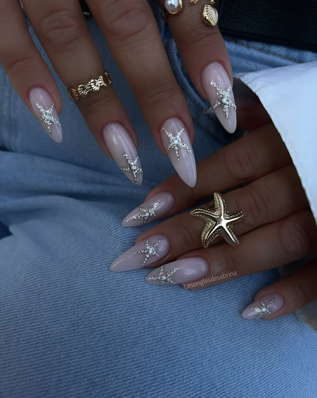 july nails design ideas 2026 Elegant Starfish Accents for a Coastal Summer