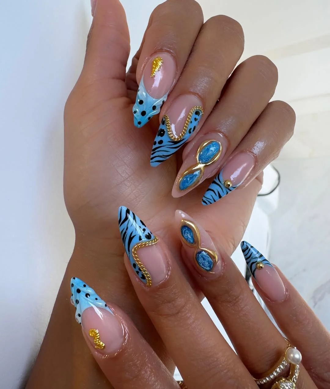july nails design ideas 2026 Blue Safari Glam Nails