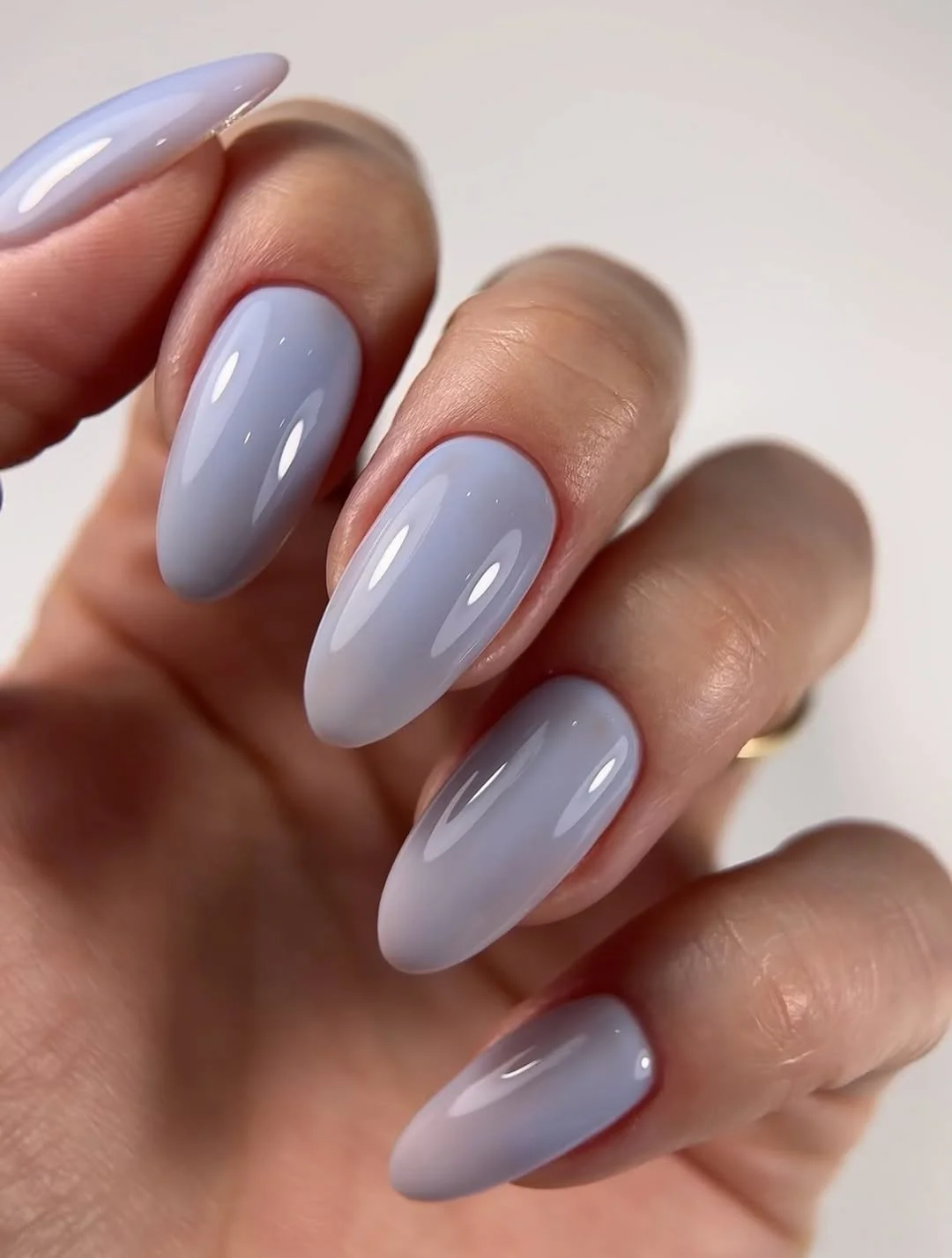 plain summer nails 2026 Soft Blue Glossy Almond Nails