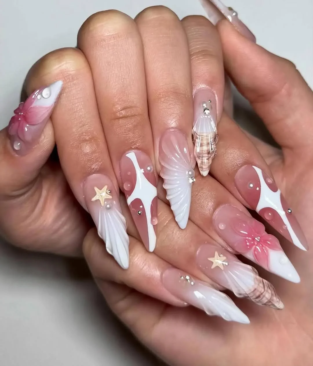 starfish summer nails 2026 Statement Seashell Art on Long Stiletto Nails