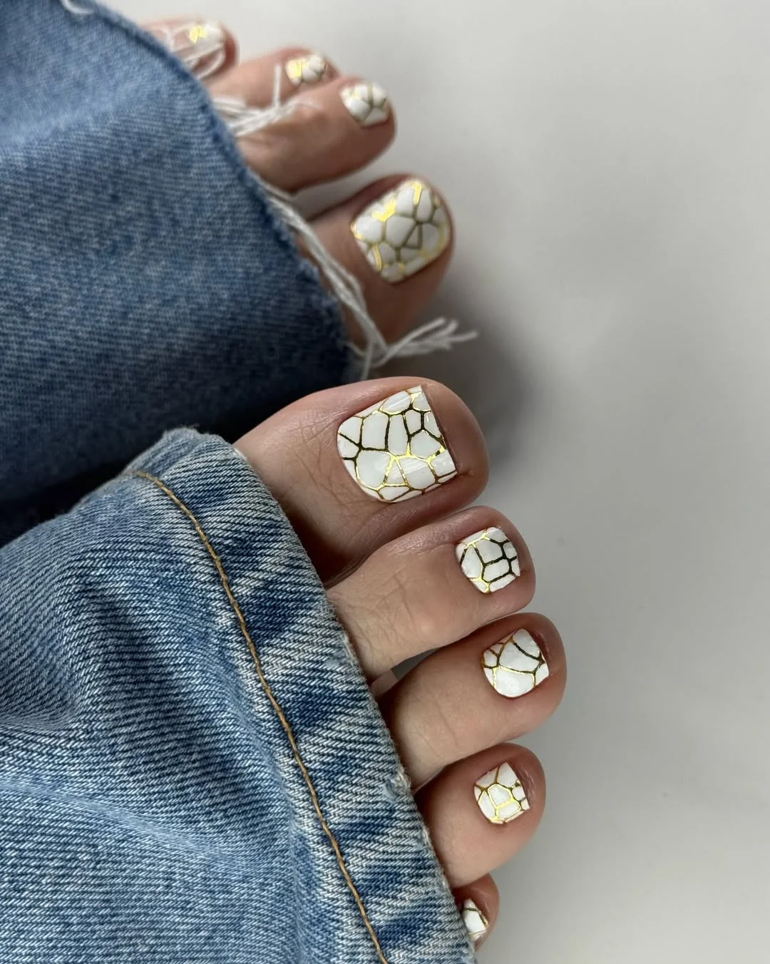 summer pedicure nail art 2026 White Marble Mosaic Pedicure With Gold Accents