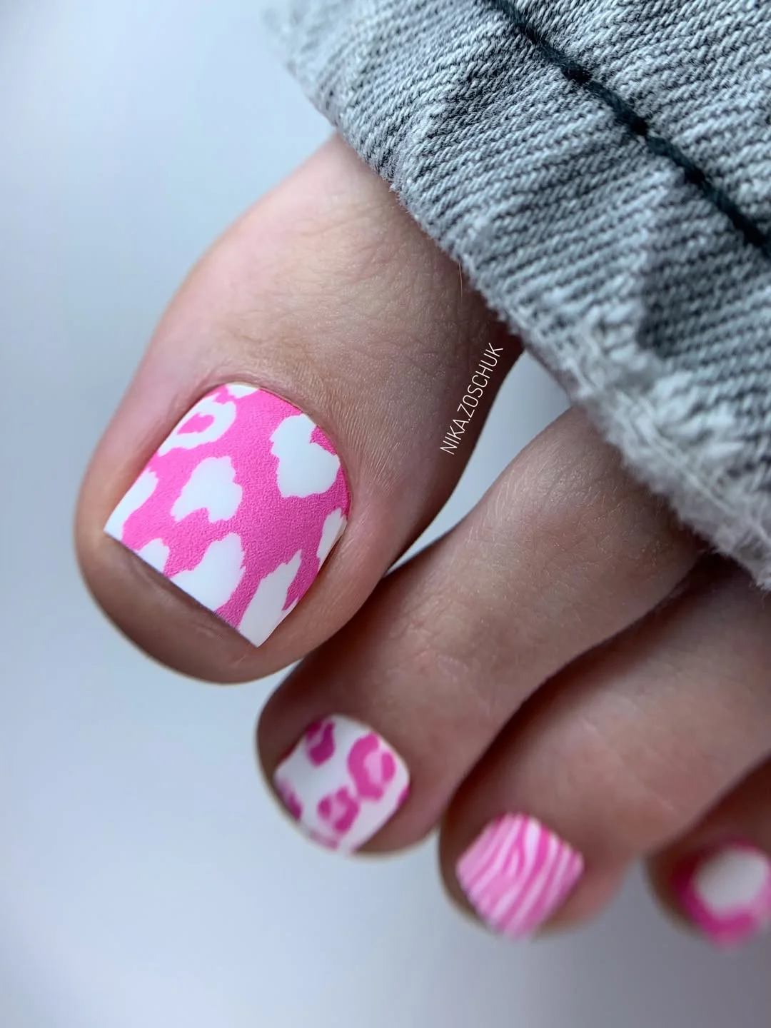 summer toe nails design ideas 2026 Playful Pink Animal Print Pedicure