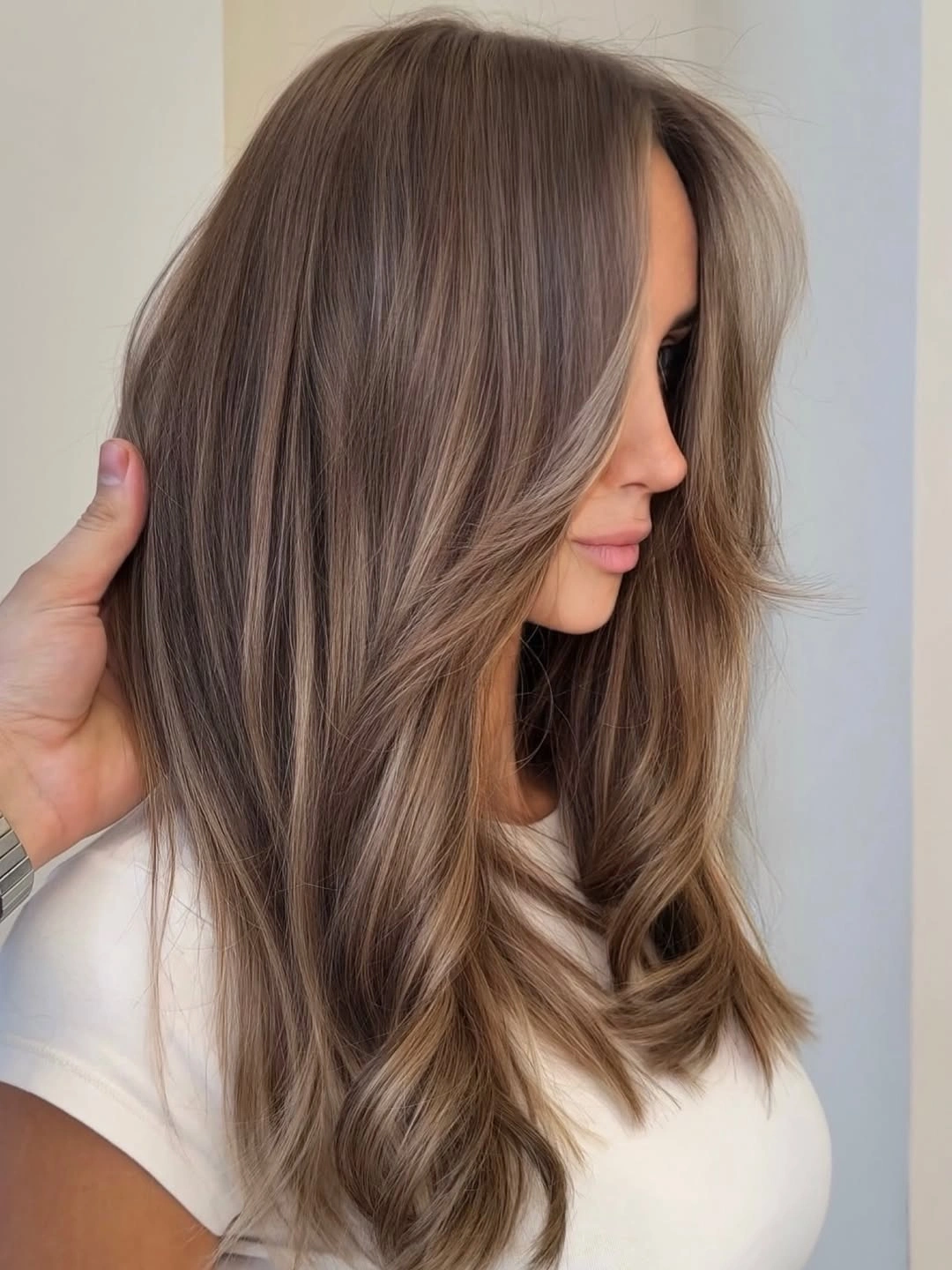 babylights hair ideas Soft Taupe Blonde Blend With Feathered Front Layers
