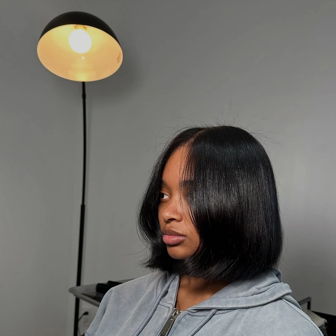 bob hairstyles for black women Sleek Center-Part Bob with Minimalist Shine