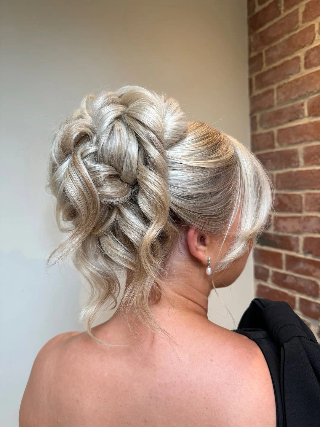 bridesmaid hairstyling Romantic Braided Floral Bun