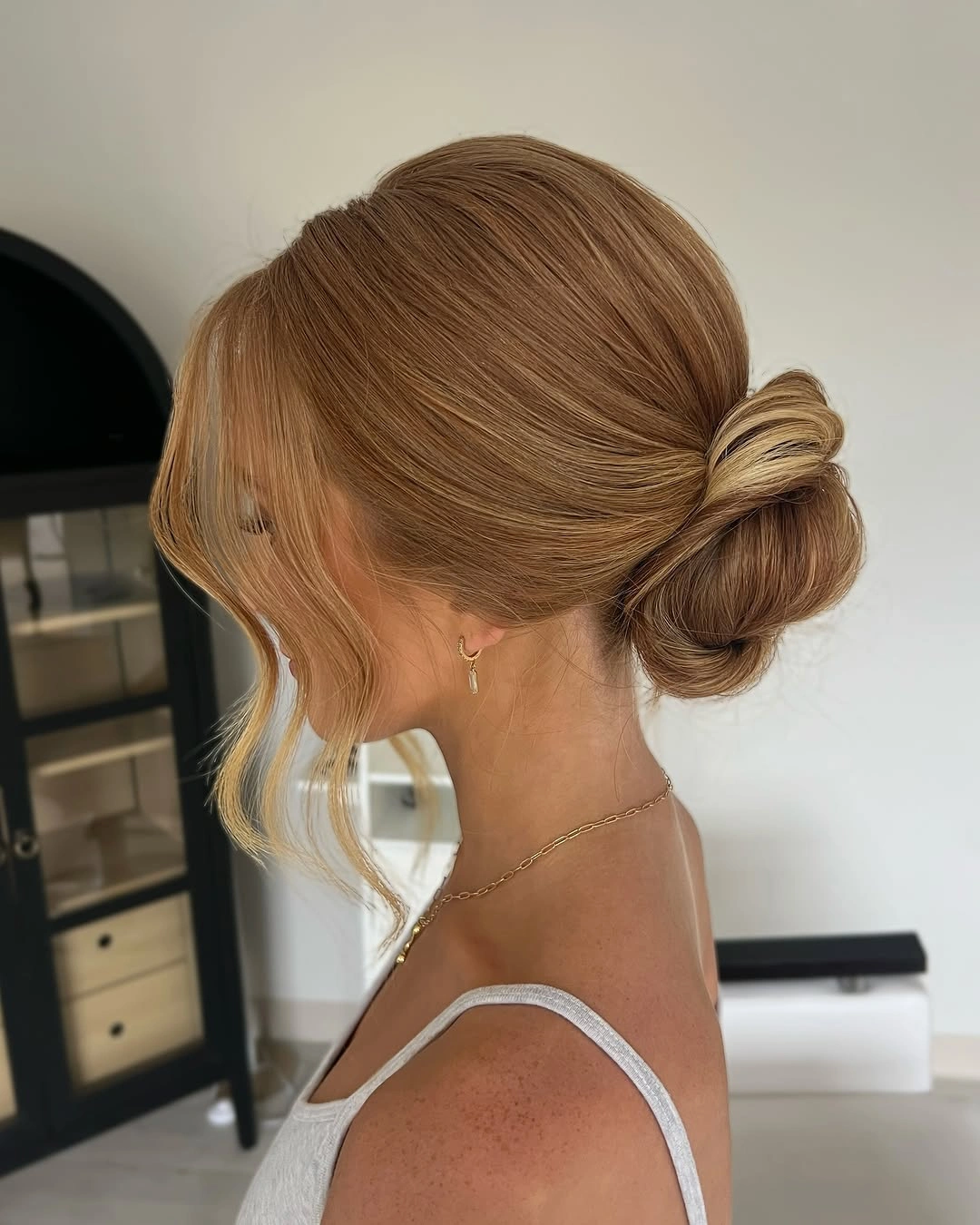 bridesmaid hairstyling Minimalist Low Chignon