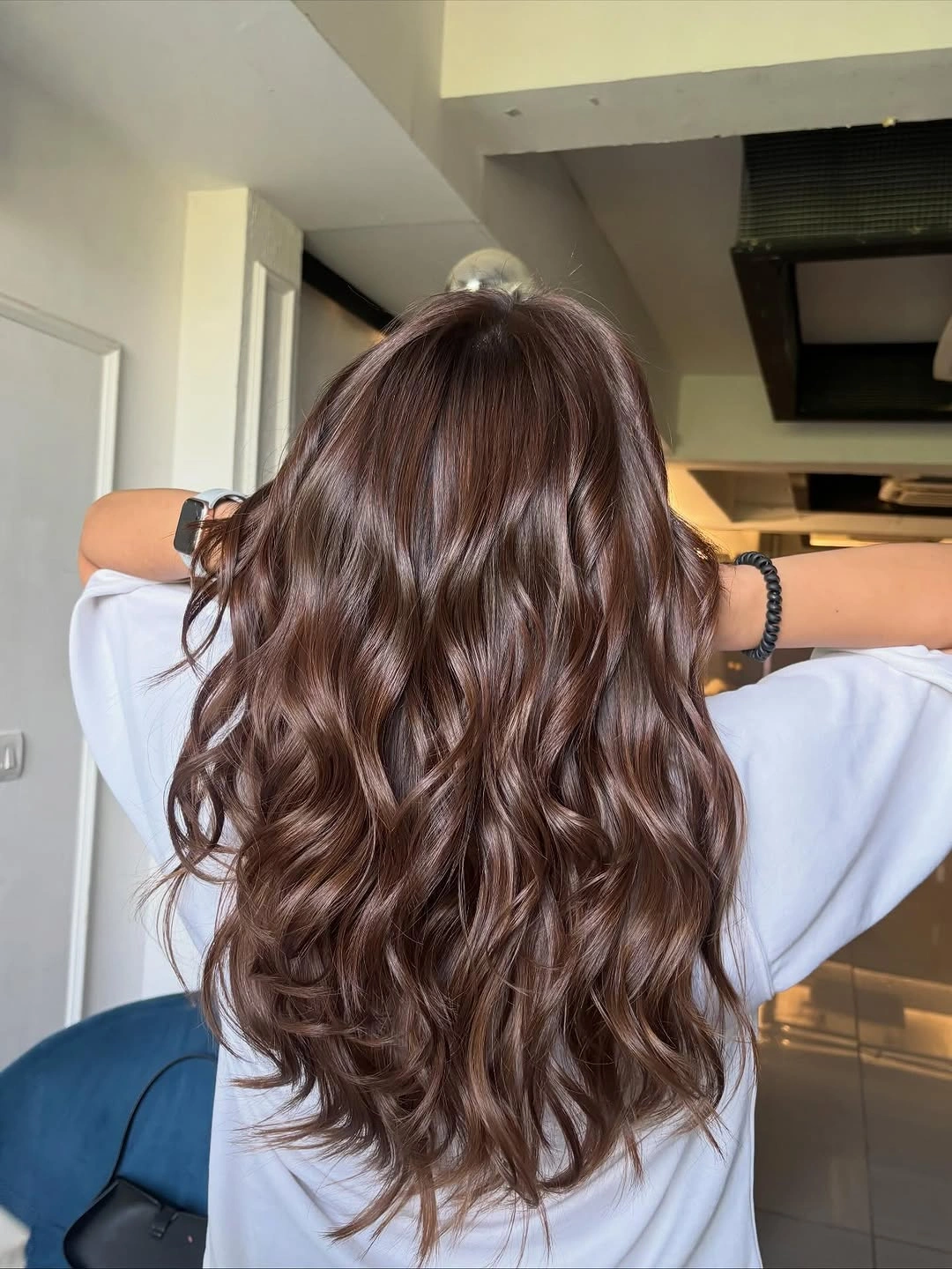 chestnut brown hair color Glossy Chestnut Waves With Effortless Dimension