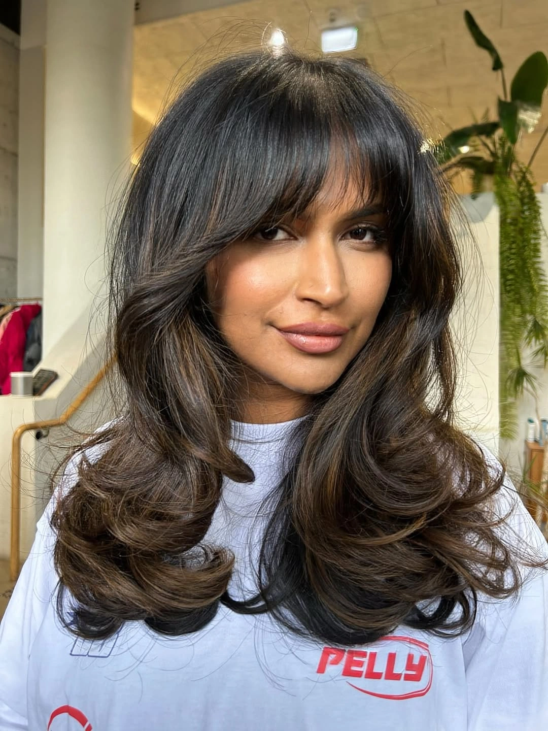 choppy medium layered hair Glossy Layers With Soft Wispy Bangs