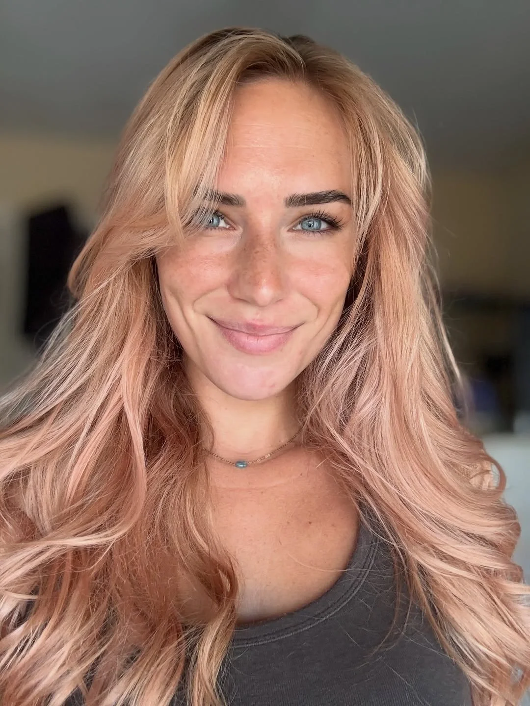 fall blonde hair colour 2026 Soft Strawberry Blonde With Airy Curtain Layers