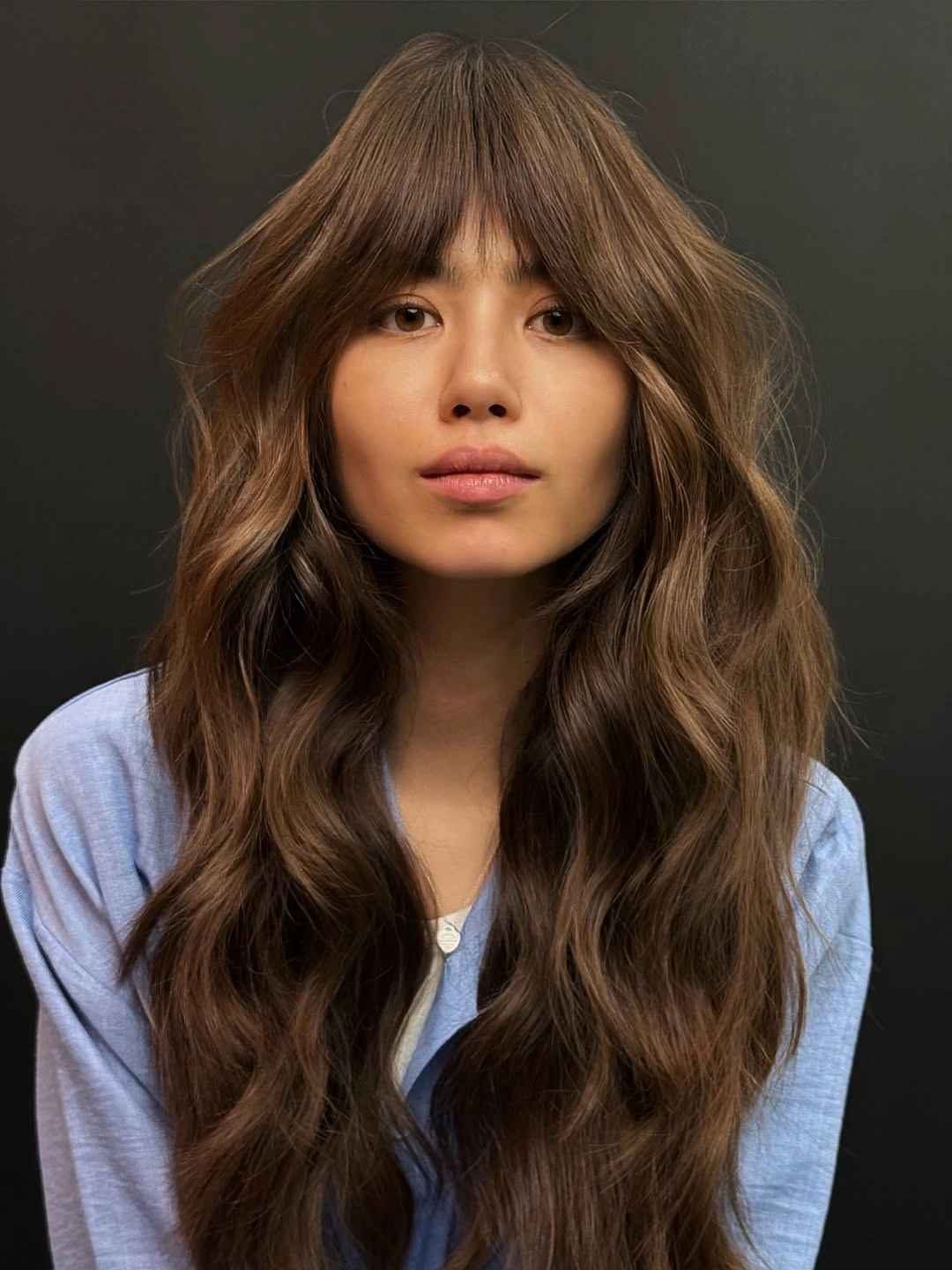 fall hairstyles 2026 Long Layered Waves With Soft Curtain Bangs