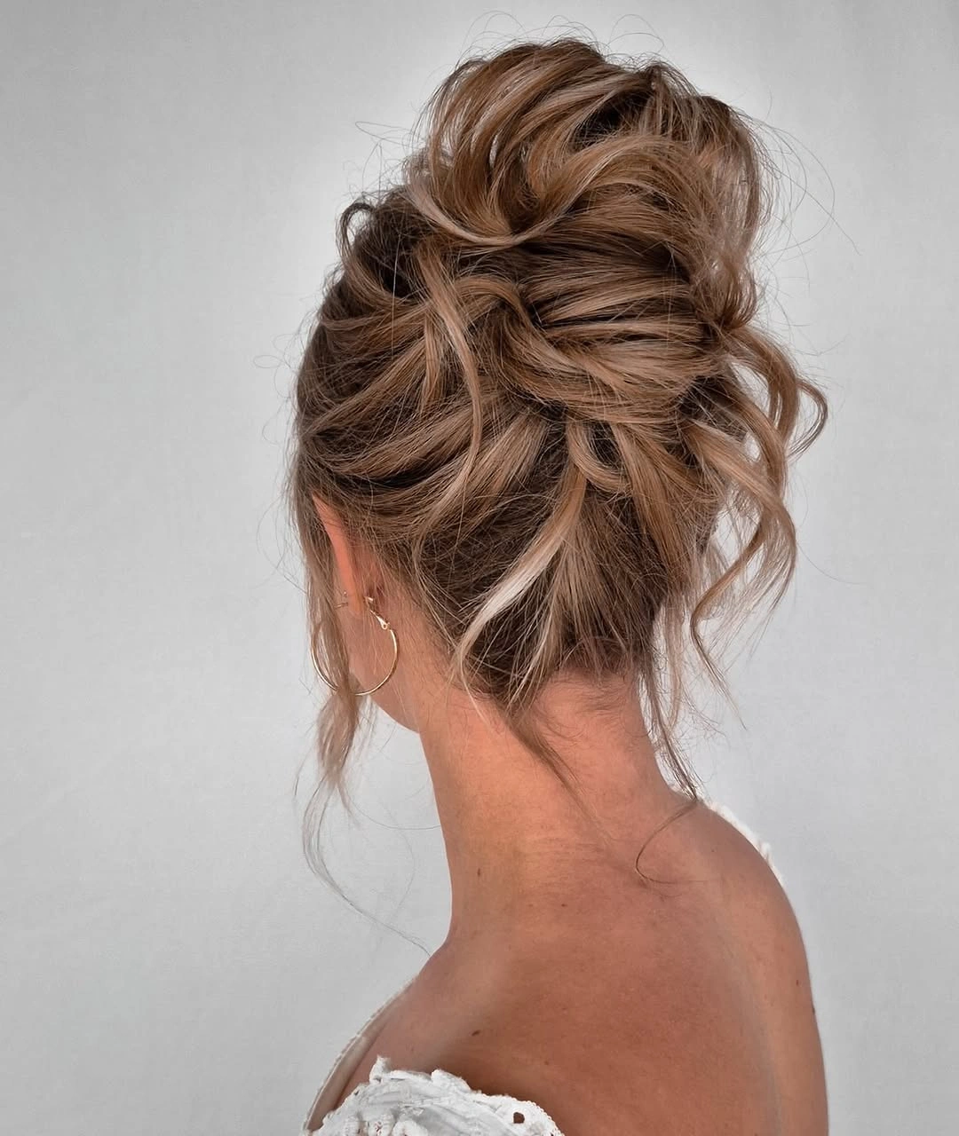 fall hairstyles 2026 Soft Messy Updo With Face Framing Pieces
