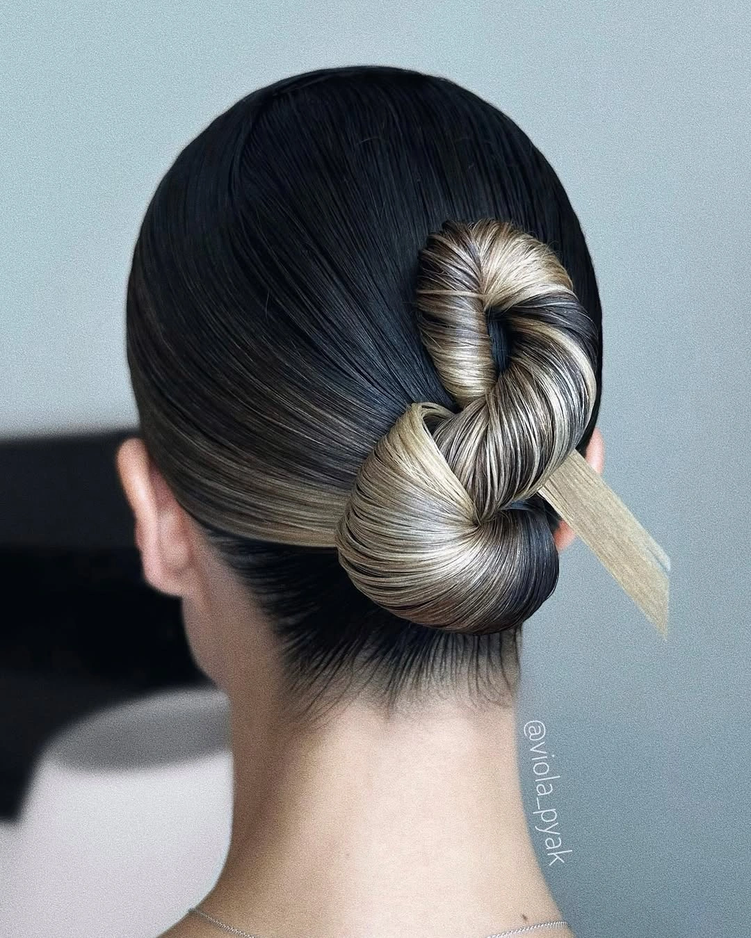 fall hairstyles 2026 Minimalist Twisted Bun With Graphic Contrast