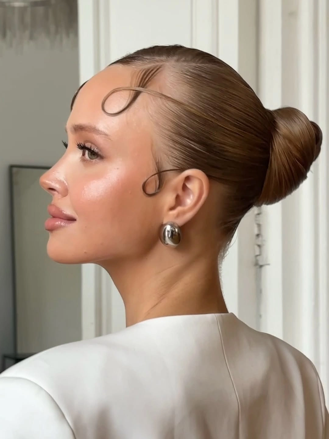 fall hairstyles 2026 Classic Ballet Bun With Modern Baby Hair