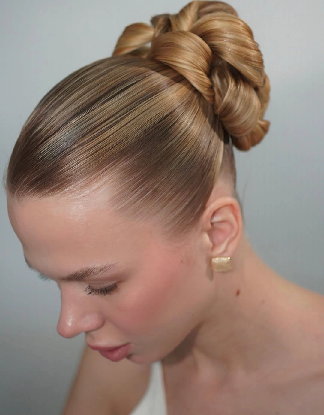 fall hairstyles for long hair 2026 Polished Bow Bun With Glass Hair Shine