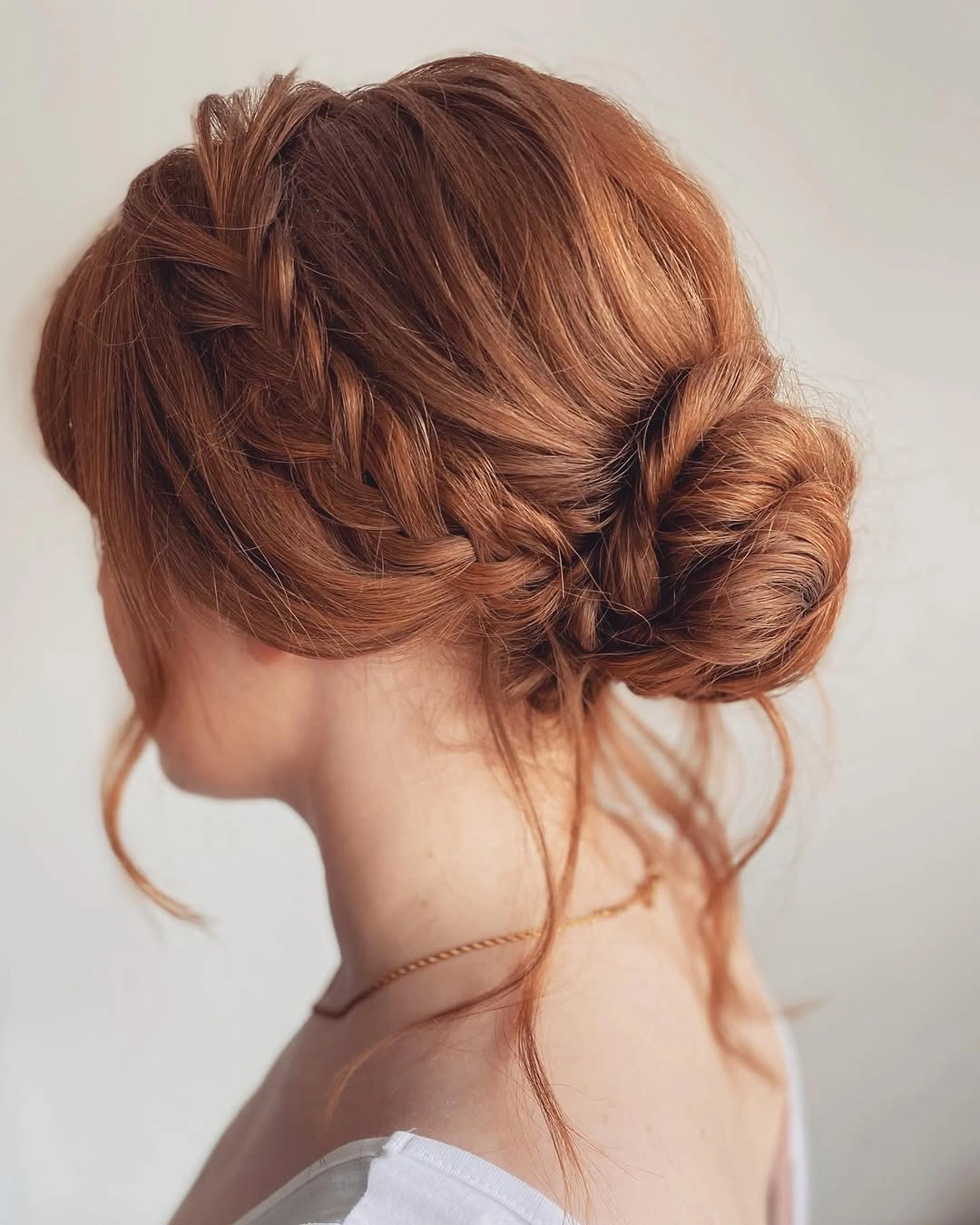 fall hairstyles for office 2026 Soft Braided Low Bun For Everyday Office Style