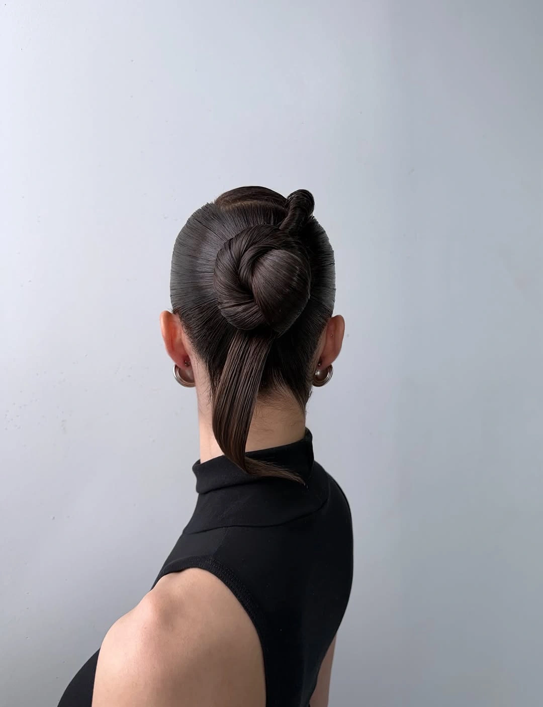 fall hairstyles for office 2026 Modern Sculptural Knot With Sleek Tail