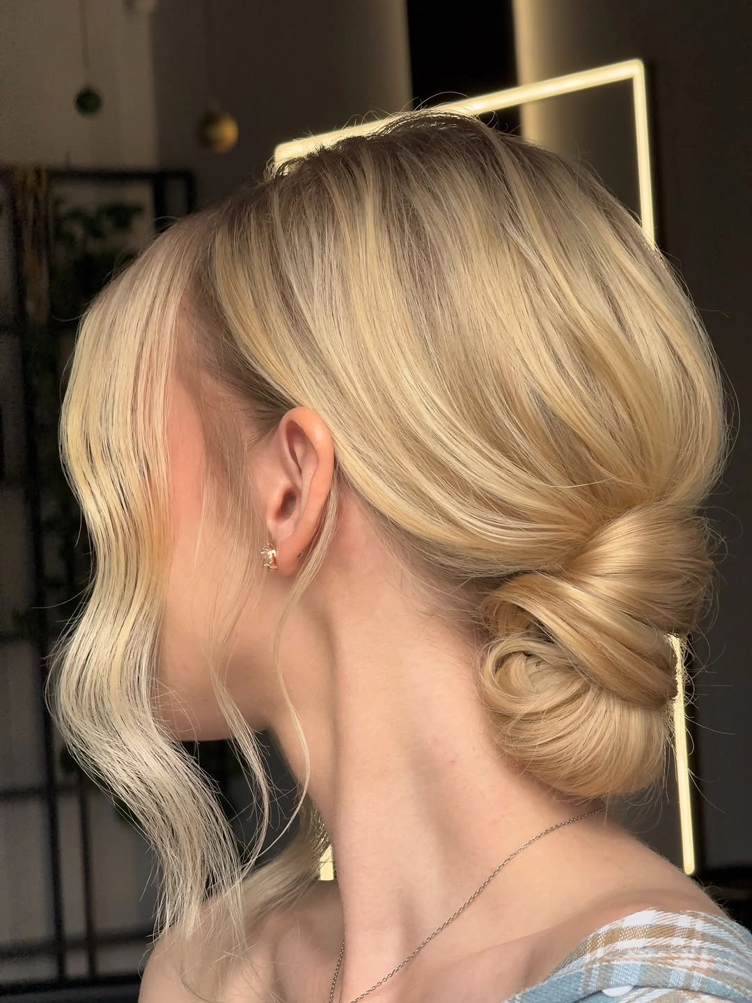 fall hairstyles for wedding guests 2026 Soft Blonde Twisted Chignon